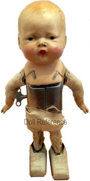 1925-1927  Louis Wolf  Toddling Toddles key wound walking doll, 12" tall