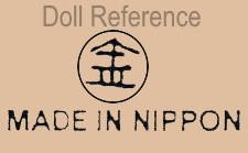 Aiba Kintoro Marugane celluloid doll mark symbol of an umbrella (or an arrow pointing up) with the pole as the center in roman numeral III all inside a circle MADE IN NIPPON