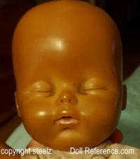 1987 Musical sleeping baby doll, 10"