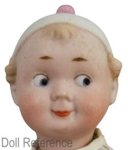 Recknagel doll mold 43 bisque head, 11" tall, googly eyed boy with a molded cap doll,