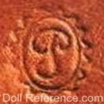French doll shoe mark P inside an oval inside a serrated wavy oval